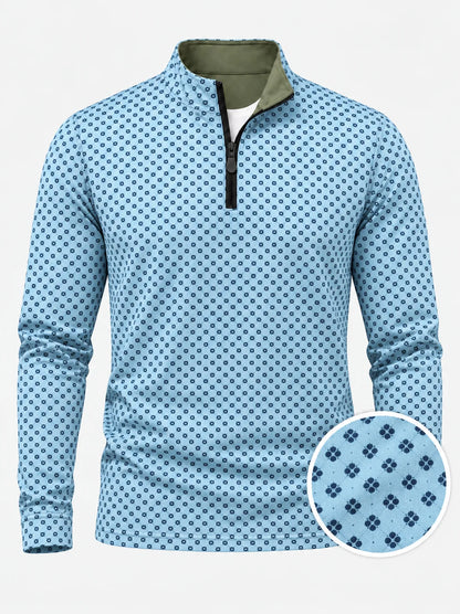 Performance-Golfpullover in Himmelblau mit Blumenmuster und Viertelreißverschluss