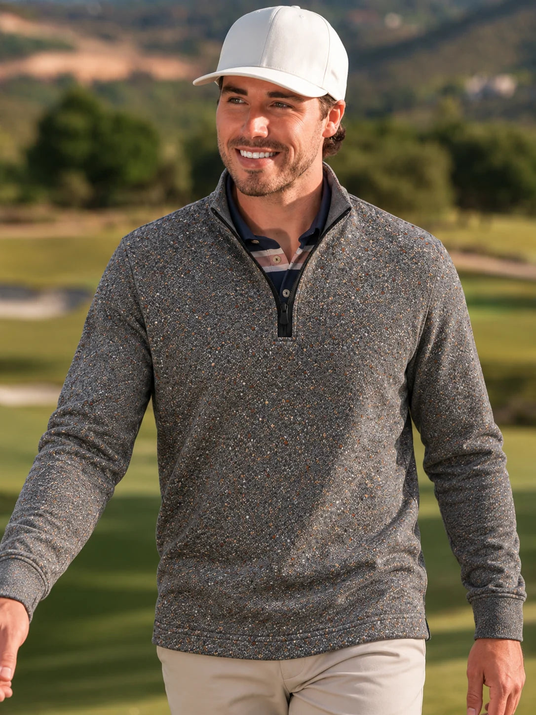 Golf-Pullover mit Viertelreißverschluss und Donegal-Tweed-Muster in meliertem Grau