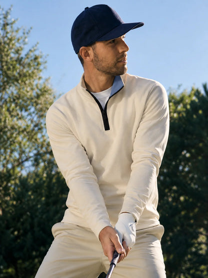 Golf-Pullover aus Funktionsmaterial in Elfenbeincreme mit einfarbigem Design und Viertelreißverschluss