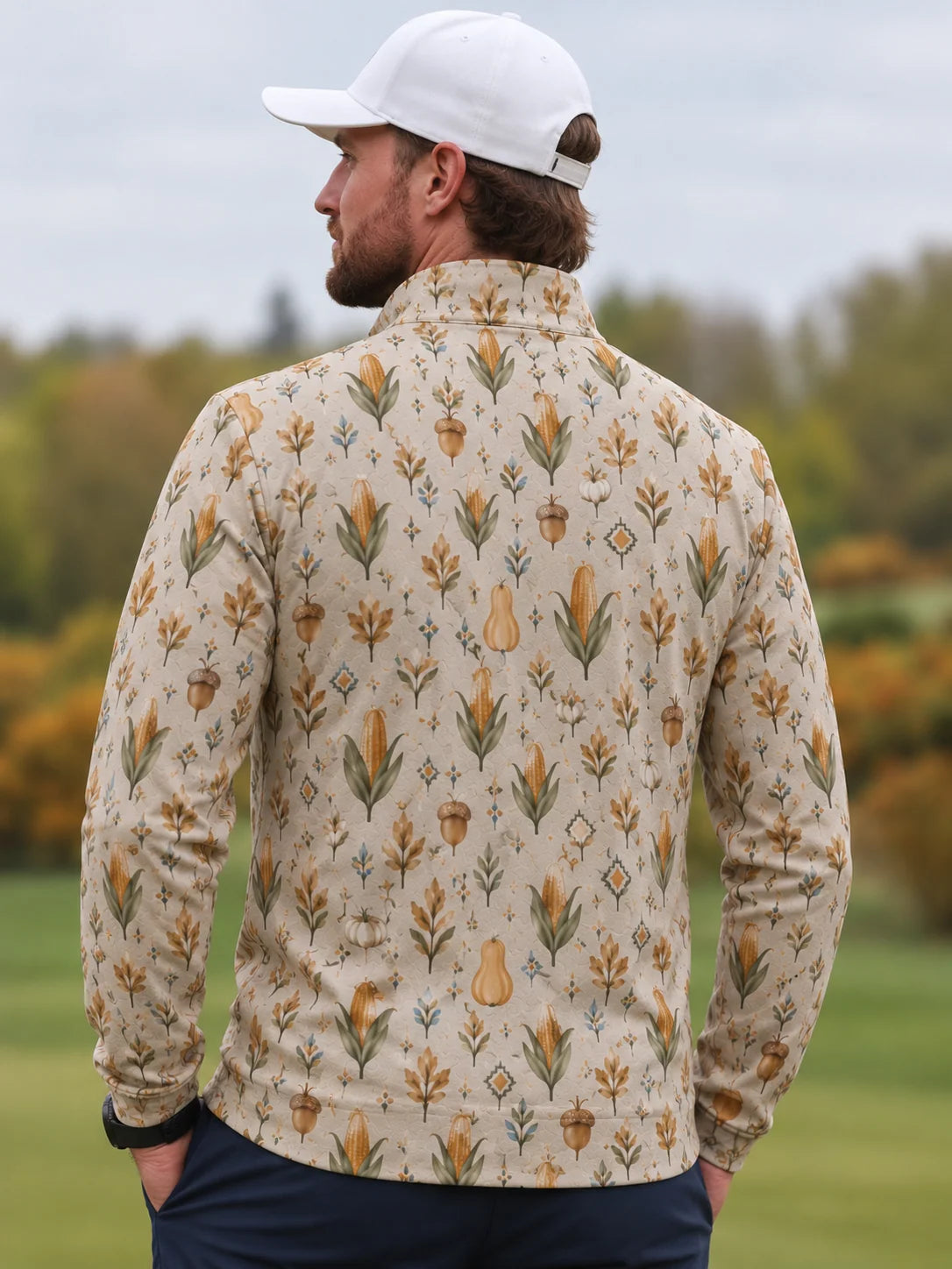 Performance-Golfpullover in Creme mit Erntemotiv und Viertelreißverschluss