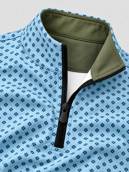 Performance-Golfpullover in Himmelblau mit Blumenmuster und Viertelreißverschluss