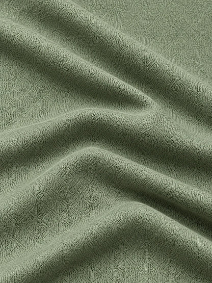 Salbeigrüner Golf-Pullover mit strukturierter Oberfläche und Viertelreißverschluss aus Funktionsmaterial