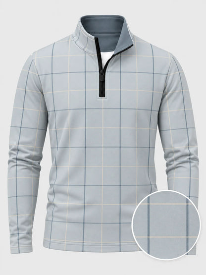Golfpullover in Puderblau mit Fensterkaromuster und Viertelreißverschluss